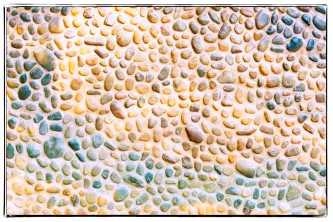 Pebble wall texture Stock Photos