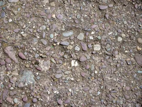 Pebbled ground texture with mixed small stones Stock Photos