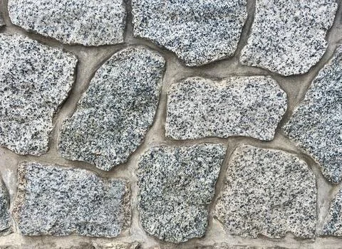 Pebbled stone wall texture Stock Photos
