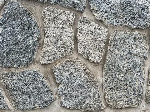 Pebbled stone wall texture Stock Photos