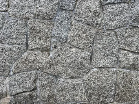 Pebbled stone wall texture Stock Photos