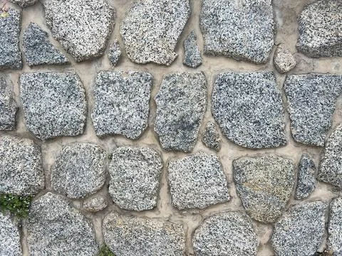 Pebbled stone wall texture Stock Photos