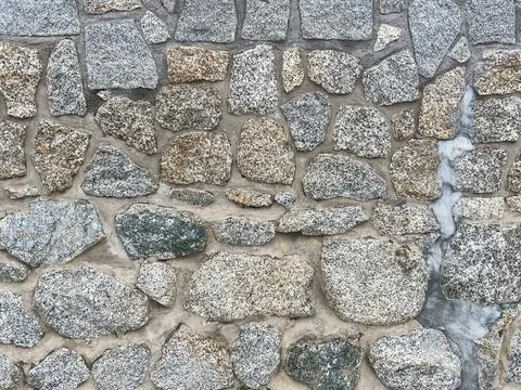 Pebbled stone wall texture Stock Photos