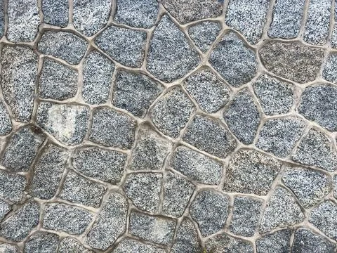 Pebbled stone wall texture Stock Photos