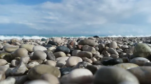 Pebbles and sea,slow motion Stock Footage 87213993