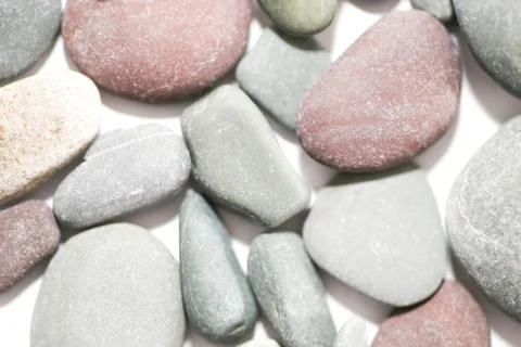 Pebbles background - assorted pebbles background Stock Photos