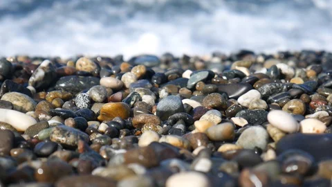 Pebbles on the beach against the background of the sea. Stock Footage 127734728