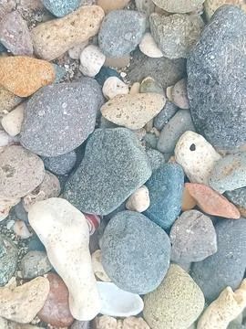 Pebbles on the beach are suitable for background Stock Photos