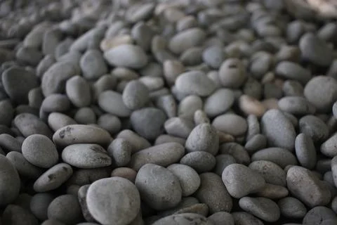 Pebbles on the Beach with shallow depth-of-field Stock Photos