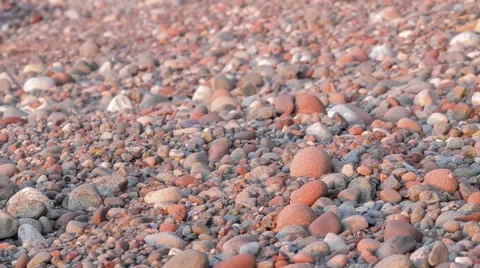 Pebbles on Beach at Sunset Video stock 65321388