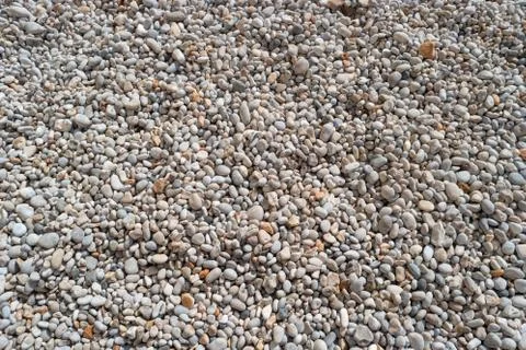 Pebbles on the beach for texture and background Stock Photos
