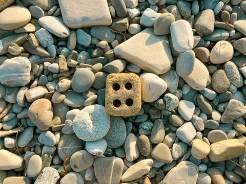 Pebbles on the beach top view Stock Photos