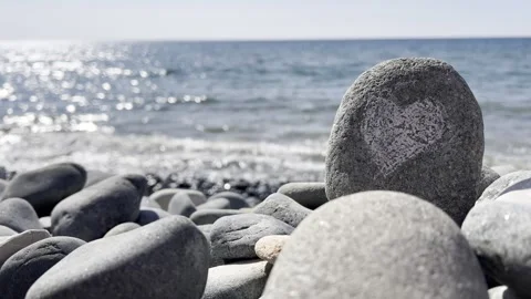 Pebbles on a Calm Seashore Stock Footage 323329270
