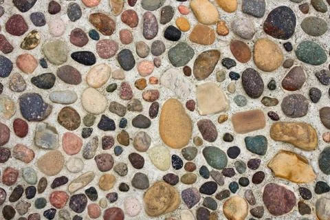 Pebbles in Concrete Stock Photos