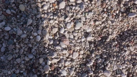 Pebbles falling and scattering on beach, slow motion Stock Footage 327248301
