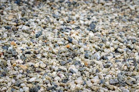 Pebbles on the ground background Stock Photos