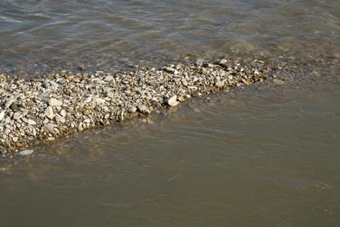 Pebbles at the river shore Fotos de archivo