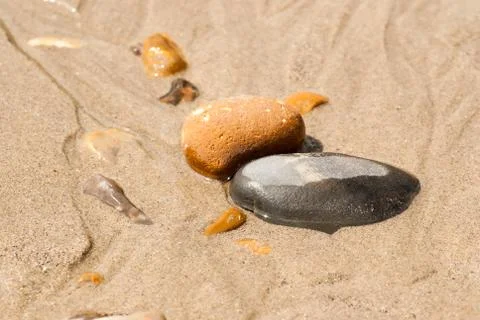 Pebbles in the sand central Stock Photos