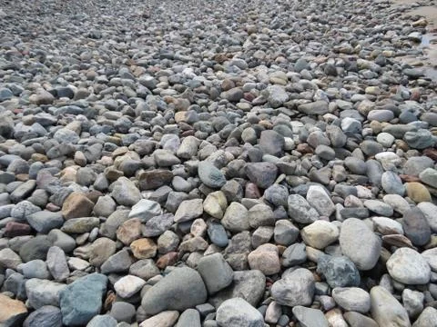 Pebbles on sea shore Stock Photos