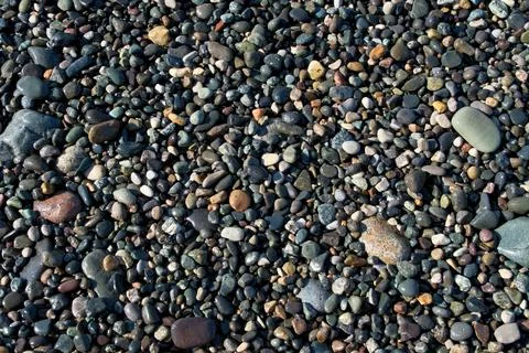 Pebbles on the seashore as an abstract background. Foto stock