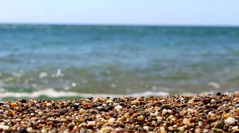 Pebbles seaside shore sand wave Stock Footage 67835562