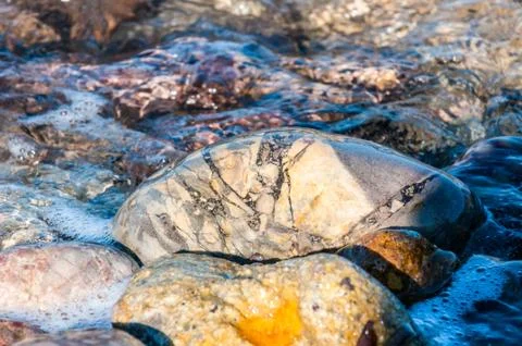 Pebbles in the shore Stock Photos