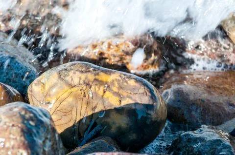Pebbles in the shore Stock Photos