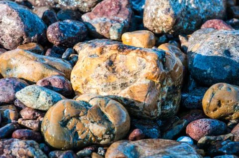 Pebbles in the shore Stock Photos
