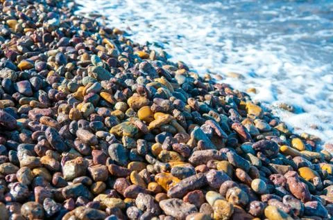 Pebbles in the shore Stock Photos