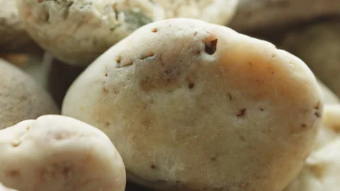 Pebbles stone macro close up presentation slowly rotating stock footage Stock Footage 344699701