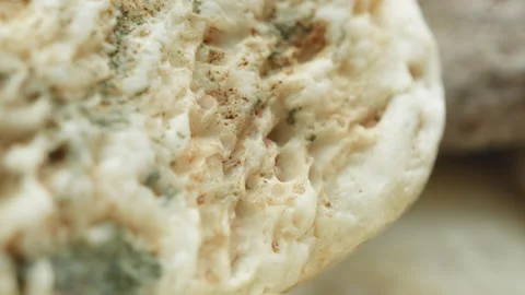Pebbles stone macro close up presentation slowly rotating stock footage Stock Footage 344699840