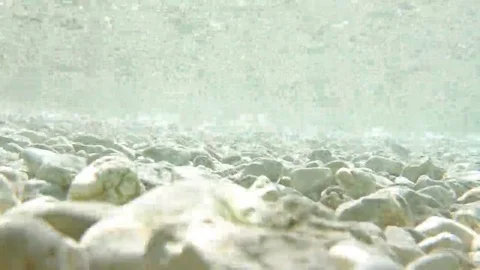 Pebbles under water Stock Footage