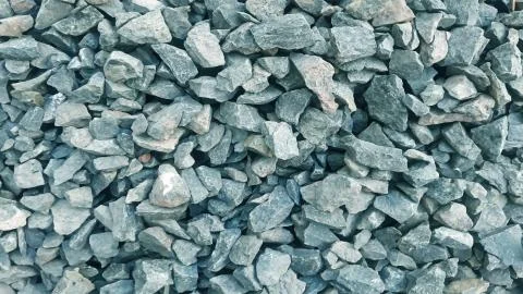 Pebbles wall texture. Surface of pebbles background for design and decoration Stock Photos