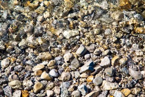 Pebbles in the water as a background Stock Photos