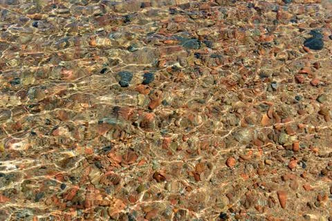 Pebbles in water Stock Photos