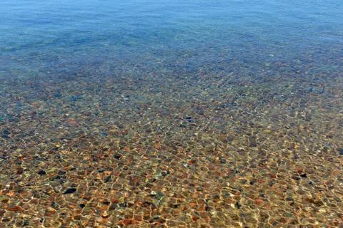 Pebbles in water Stock Photos