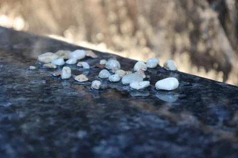 Pebbles with waterfall backdrop Foto stock