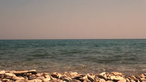 Pebbly beach with view of the horizon 스톡 동영상 116638207