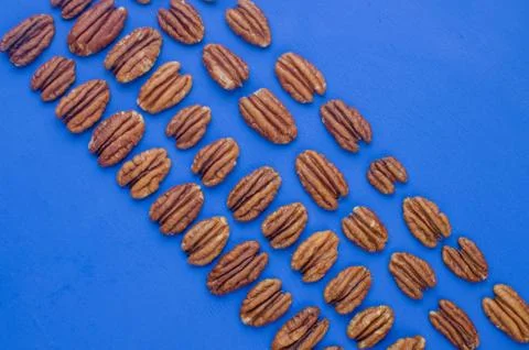 Pecan nut on a blue background. concept of healthy eating Stock Photos
