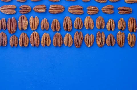Pecan nut on a blue background. concept of healthy eating Stock Photos