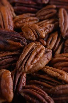 Pecan nuts background vertical close-up hd. Nuts texture Stock Photos