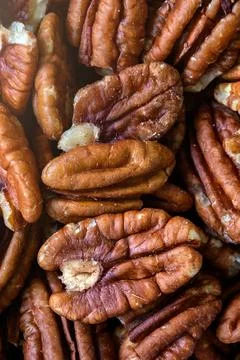 Pecan nuts. Close up of pecan nuts background. Top view Stock Photos
