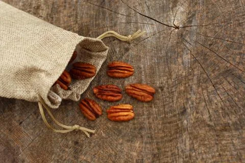 Pecan nuts in a jute sack Stock Photos
