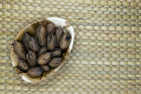 Pecan Nuts with the Nutshell in Eco Natural Banana Leaf Plate Stock Photos