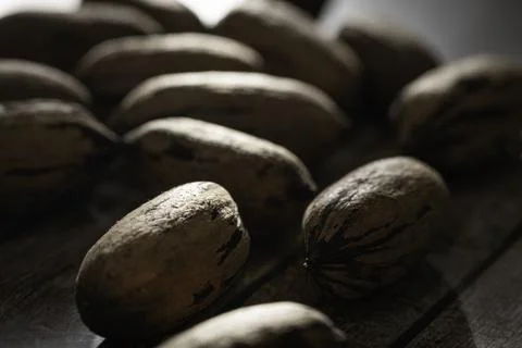 Pecan Nuts In Shell On Wood Table Stock Photos