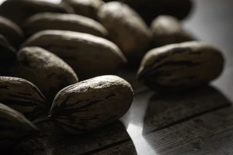 Pecan Nuts In Shell On Wood Table Stock Photos