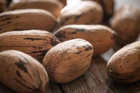 Pecan Nuts In Shell On Wood Table Stock Photos