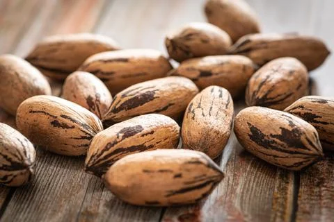 Pecan Nuts In Shell On Wood Table Stock Photos