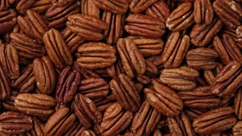 Pecan nuts top view, rotation. Healthy food concept. 4K UHD video Stock Footage 153518245