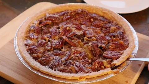 Pecan Pie or Chess Pie Placing Cutting Slice Motion Roasted Nuts Fresh Pie Video stock 145874737